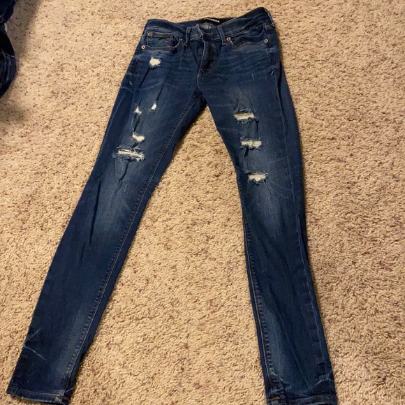 LIKE NEW Express women’s stretch ripped jean leggings mid rise in size 2R - Picture 2 of 9